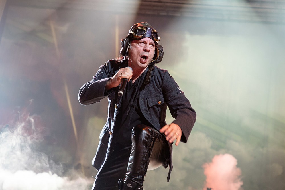 Iron Maiden’s Bruce Dickinson Has COVID, Says He ‘Could Be in Serious Trouble’ If He Wasn’t Vaccinated Iron Maiden’s Bruce Dickinson Has COVID, Says He ‘Could Be in Serious Trouble’ If He Wasn’t Vaccinated