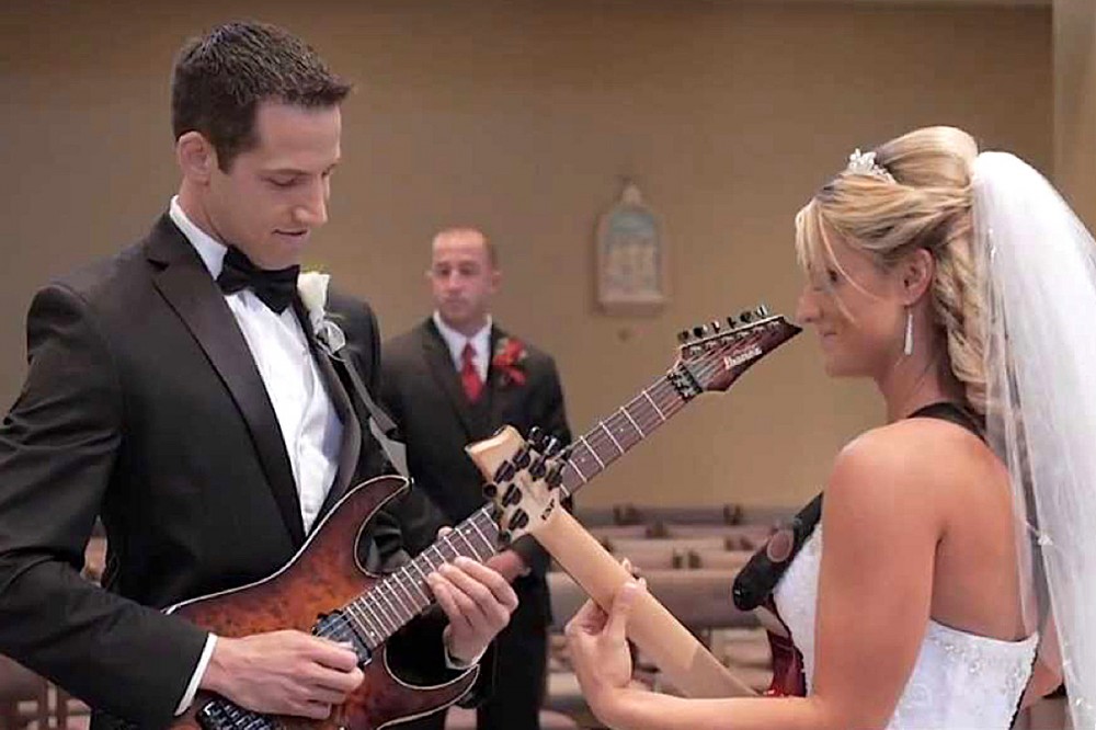 Watch This Shred-Tastic Wedding Entrance With Bride + Groom Guitarists Watch This Shred-Tastic Wedding Entrance With Bride + Groom Guitarists