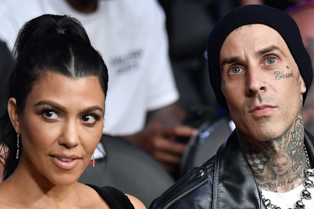 Travis Barker + Kourtney Kardashian Share Engagement Photos That Show Their Odd Joint Logo Travis Barker + Kourtney Kardashian Share Engagement Photos That Show Their Odd Joint Logo