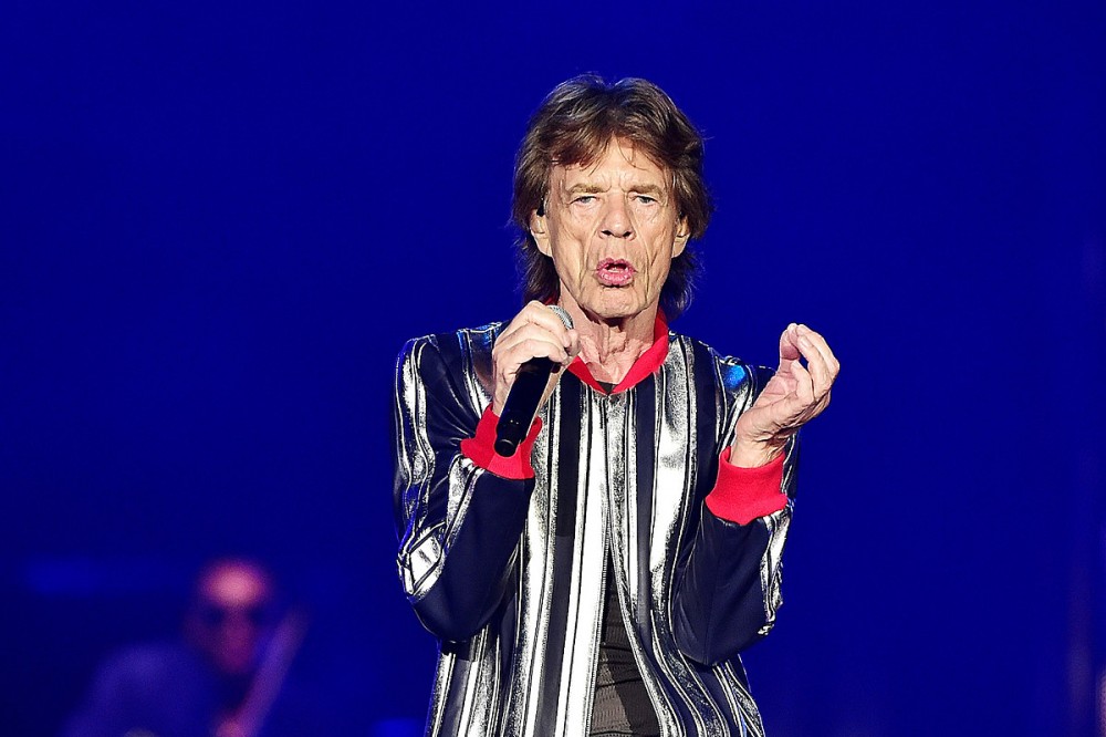 QAnon Followers Believed JFK Jr. Would Return From the Dead at a Rolling Stones Concert, He Did Not QAnon Followers Believed JFK Jr. Would Return From the Dead at a Rolling Stones Concert, He Did Not