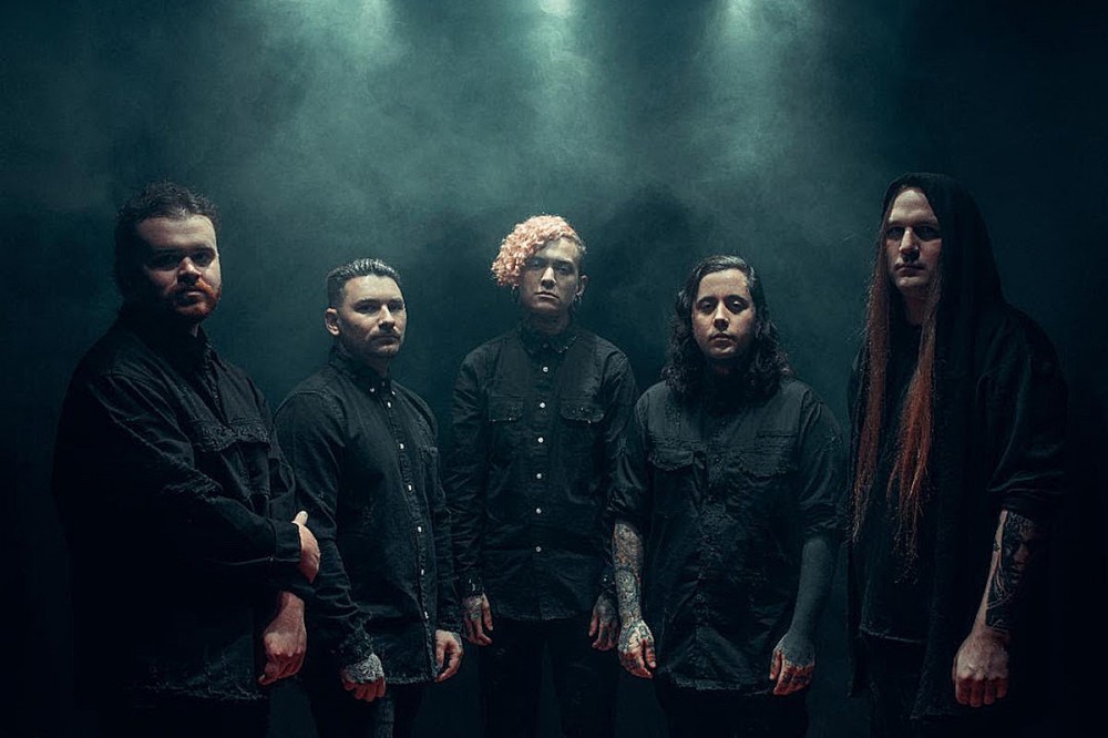 Lorna Shore’s New Song ‘Cursed to Die’ Is as Brutal as It Is Epic Lorna Shore’s New Song ‘Cursed to Die’ Is as Brutal as It Is Epic