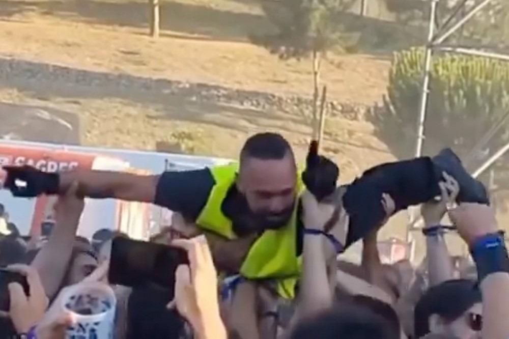 Watch Security Guard Crowd Surf at Metal Festival Watch Security Guard Crowd Surf at Metal Festival